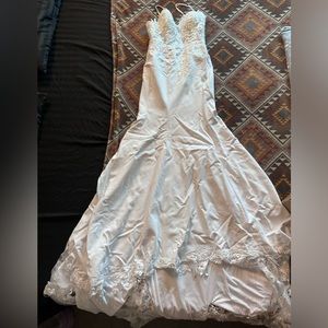 Wedding dress only used one is in excellent condition is size Small
